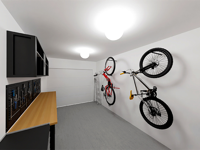Garage d'une maison avec établi de bricolage et deux vélos